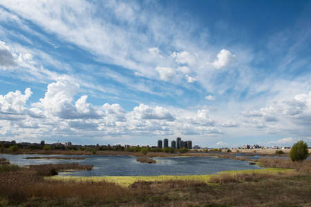 Bucharest, Romania - April 2, 2015: Urban contrast between Asmita Garden residential buildings and wild delta Vacaresti in south-eastern Bucharest.のeditorial素材