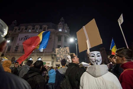 Bucharest, Romania  November 4, 2015: For a second consecutive night, over 30.000 people gathered at the University Square in Bucharest and protest against the government and the corruption.のeditorial素材