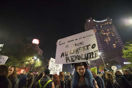 Bucharest, Romania  November 4, 2015: For a second consecutive night, over 30.000 people gathered at the University Square in Bucharest and protest against the government and the corruption.のeditorial素材