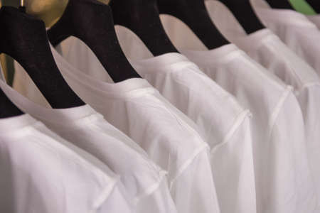 White t-shirts in a shopの写真素材