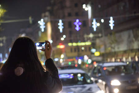 Bucharest, Romania â November 30, 2014: Nightscene in Bucharest center when the Christmas lights and decorations are on.のeditorial素材