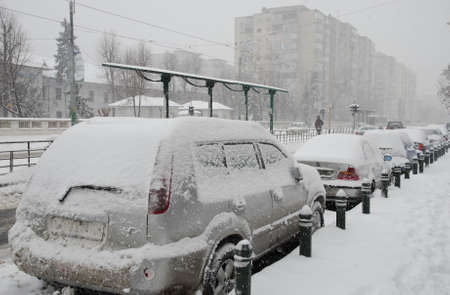 Bucharest, Romania â January 26, 2014: A street in Bucharest center after massive snowing. Heavy snow caused traffic chaos in Romania, much of the traffic in urban Bucharest was jammed.のeditorial素材