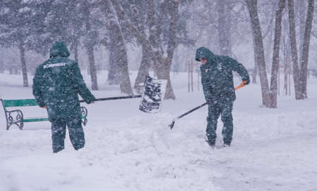 Bucharest, Romania â January 26, 2014: A street in Bucharest center after massive snowing. Heavy snow caused traffic chaos in Romania, much of the traffic in urban Bucharest was jammed.のeditorial素材