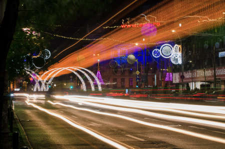 Bucharest, Romania â December 11, 2013: Nightscene in Bucharest center when the Christmas lights and decorations are on.のeditorial素材