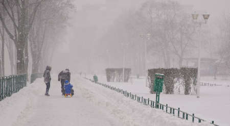 Bucharest, Romania â January 26, 2014: A street in Bucharest center after massive snowing. Heavy snow caused traffic chaos in Romania, much of the traffic in urban Bucharest was jammed.のeditorial素材