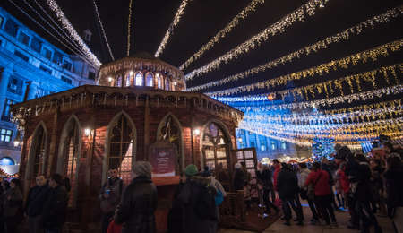 BUCHAREST, ROMANIA - DECEMBER 03, 2015: Christmas market at night in Bucharest downtown, at the University Square.のeditorial素材