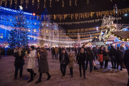 BUCHAREST, ROMANIA - DECEMBER 03, 2015: Christmas market at night in Bucharest downtown, at the University Square.のeditorial素材