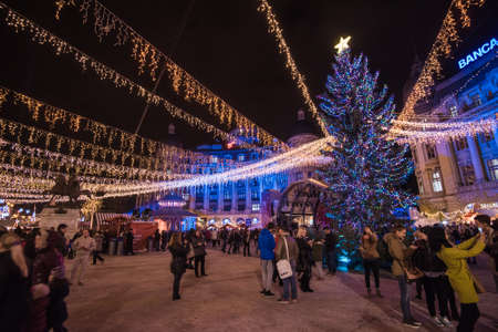 BUCHAREST, ROMANIA - DECEMBER 03, 2015: Christmas market at night in Bucharest downtown, at the University Square.のeditorial素材