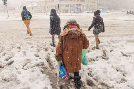 Bucharest, Romania â January 17, 2016: Bucharest downtown after massive snowing and restricted traffic, Unirii Square(Piata Unirii) and city center neighborhood.のeditorial素材