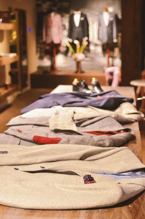 Men suits and shoes in a luxury store, artistic vision.