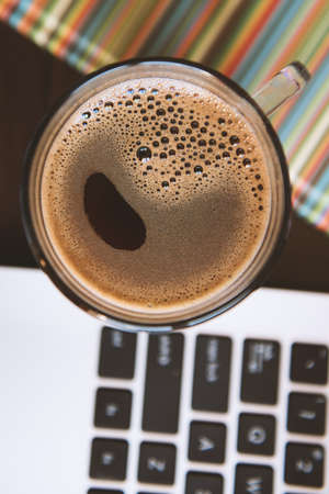 Coffee, laptop and notebook.の写真素材