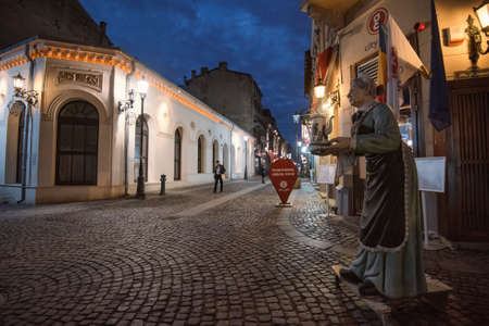 Bucharest, Romania - February 10, 2016: Narrow street in Bucharest city center at night.のeditorial素材