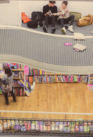 Bucharest, Romania - February 10, 2016: Teenagers studying in a public library in Bucharest.のeditorial素材