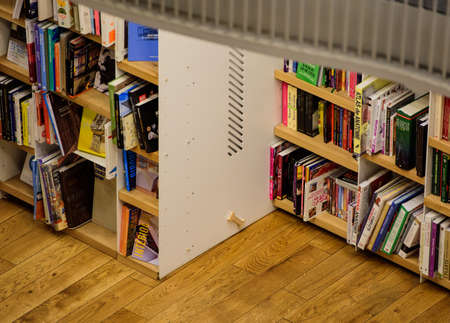 Bucharest, Romania - February 10, 2016: Books on shelves in a fancy library in Bucharest.