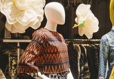Female mannequins inside a clothing store.