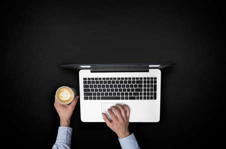 Working and taking a coffeeの写真素材