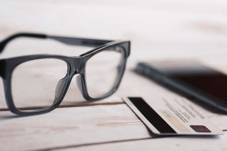 Eyeglasses, mobile phone and credit card.の写真素材