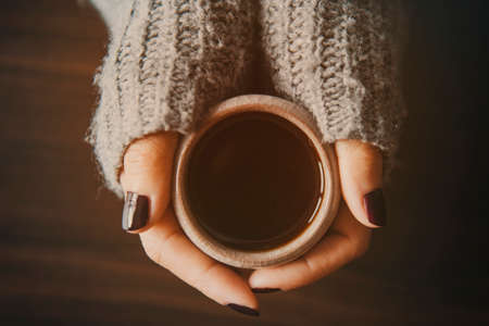 Girl holding a cup of tea