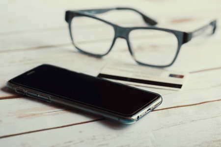 Eyeglasses, mobile phone and credit card.の写真素材