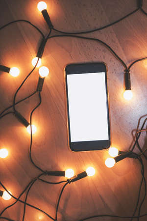 Smart phone in a cozy atmosphere.