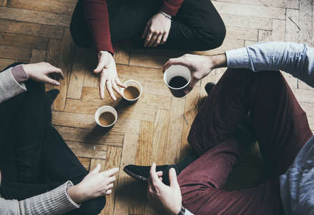 Socializng concept - friends taking a coffee and talking, hipster moodの写真素材