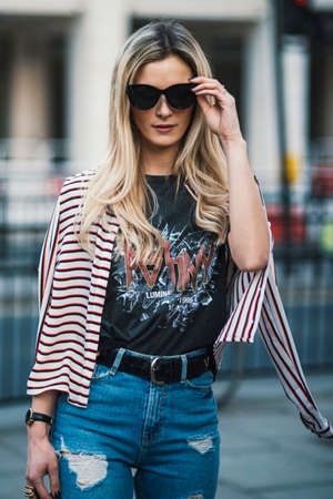 London, England â February 17, 2017: Beautiful model wearing an urban outfit, posing on the street during London Fashion Week.のeditorial素材