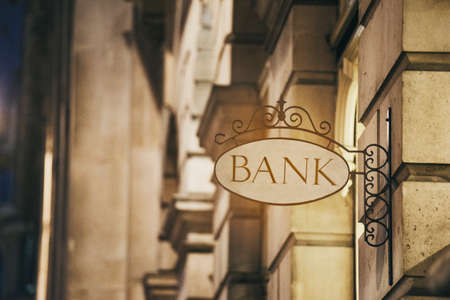 Bank sign and classic buildings - finance conceptの写真素材