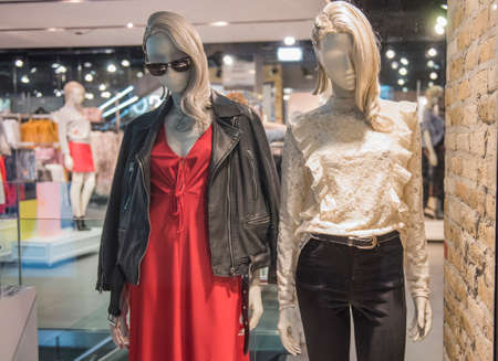Women clothing store with mannequins in showcase