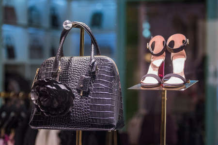 Woman handbag and shoes in a fashion boutique.の写真素材