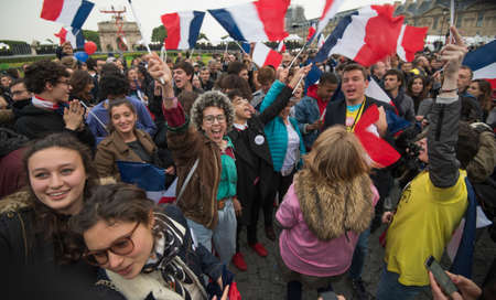 Paris, France - May 7, 2017: Crowds celebrate Macron's victory at the Louvre Museum after presidential elections.のeditorial素材