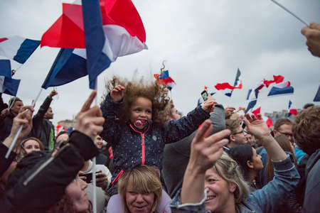 Paris, France - May 7, 2017: Crowds celebrate Macron's victory at the Louvre Museum after presidential elections.のeditorial素材