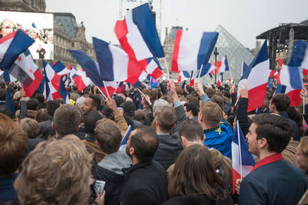 Paris, France - May 7, 2017: Crowds celebrate Macron's victory at the Louvre Museum after presidential elections.のeditorial素材