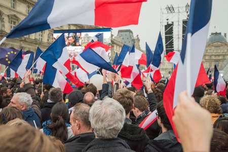 Paris, France - May 7, 2017: People waving french flags in Paris after presidential elections.のeditorial素材