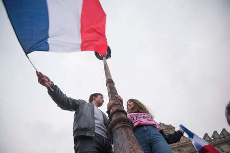 Paris, France - May 7, 2017: Crowds celebrate Macron's victory at the Louvre Museum after presidential elections.のeditorial素材