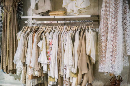 Fashionable clothes in a boutique store.の写真素材