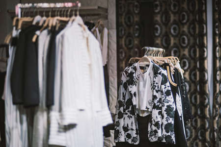 Fashionable clothes in a boutique store.の写真素材