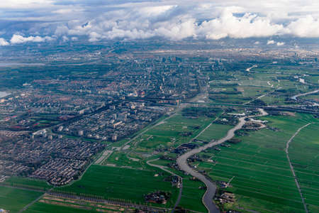 Beautiful view through airplane window, airplane flying above city.の写真素材