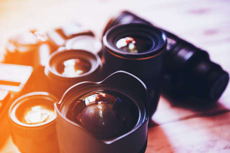 Professional camera lenses on a wood background.の写真素材