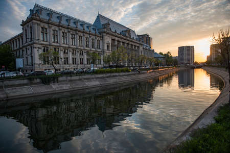 Bucharest city center at sunset - Justic Palace and Dimbovita river.の写真素材