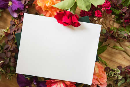 Artistic workplace covered with flowersの写真素材