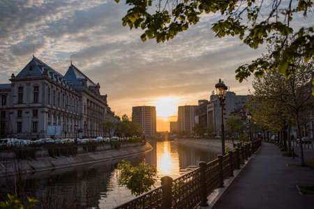 Bucharest city center at sunset - Justic Palace and Dimbovita river.の写真素材