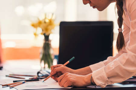 Girl working concept - business reports and charts.
