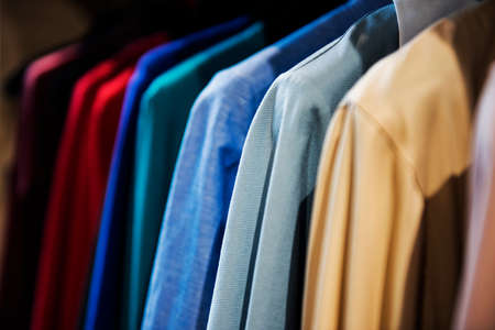 Colorful clorhes on racks in a fashion boutique