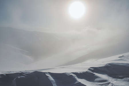 Wind on the top of a mountain - winter landscapeの写真素材