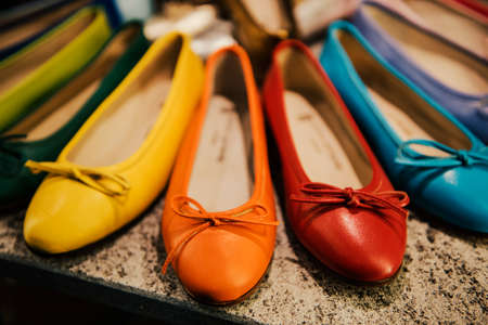 colorful shoes in a fancy shop in milanの写真素材