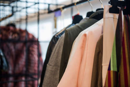 Women clothes on racks in a boutique storeの写真素材