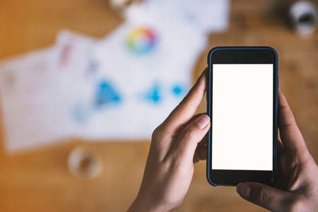 Smart phone with blank space in a cozy atmosphereの写真素材