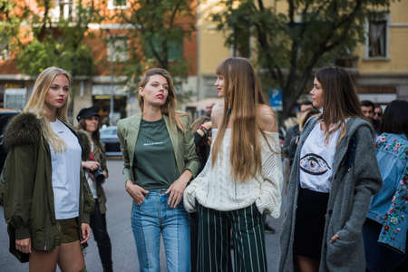 Milan, Italy - September 22, 2017: Woman with a fashionable look, poses for photographers before Armani Fashion Show at Milan Fashion Week - street style concept Spring/Summer 2018.のeditorial素材