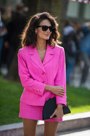Milan, Italy - September 22, 2017: Woman with a fashionable look, poses for photographers before Armani Fashion Show at Milan Fashion Week - street style concept Spring/Summer 2018.のeditorial素材