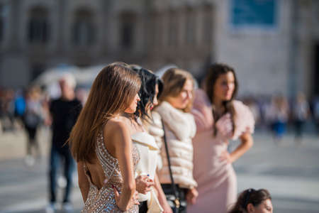 Milan, Italy - September 22, 2017: Fashionable girls during Armani Fashion Show at Milan Fashion Week - street style concept Spring/Summer 2018.のeditorial素材